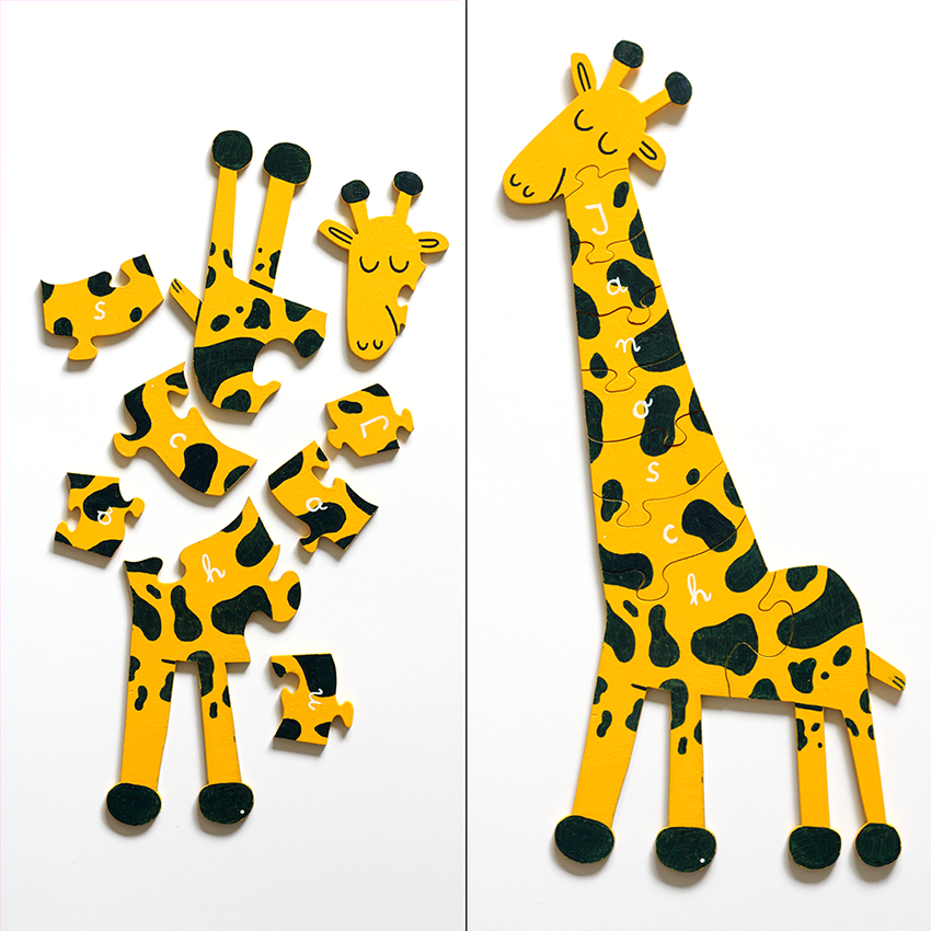 wooden cartoon giraffe as a puzzle, on the left side as random pieces, on the right side a finished giraffe